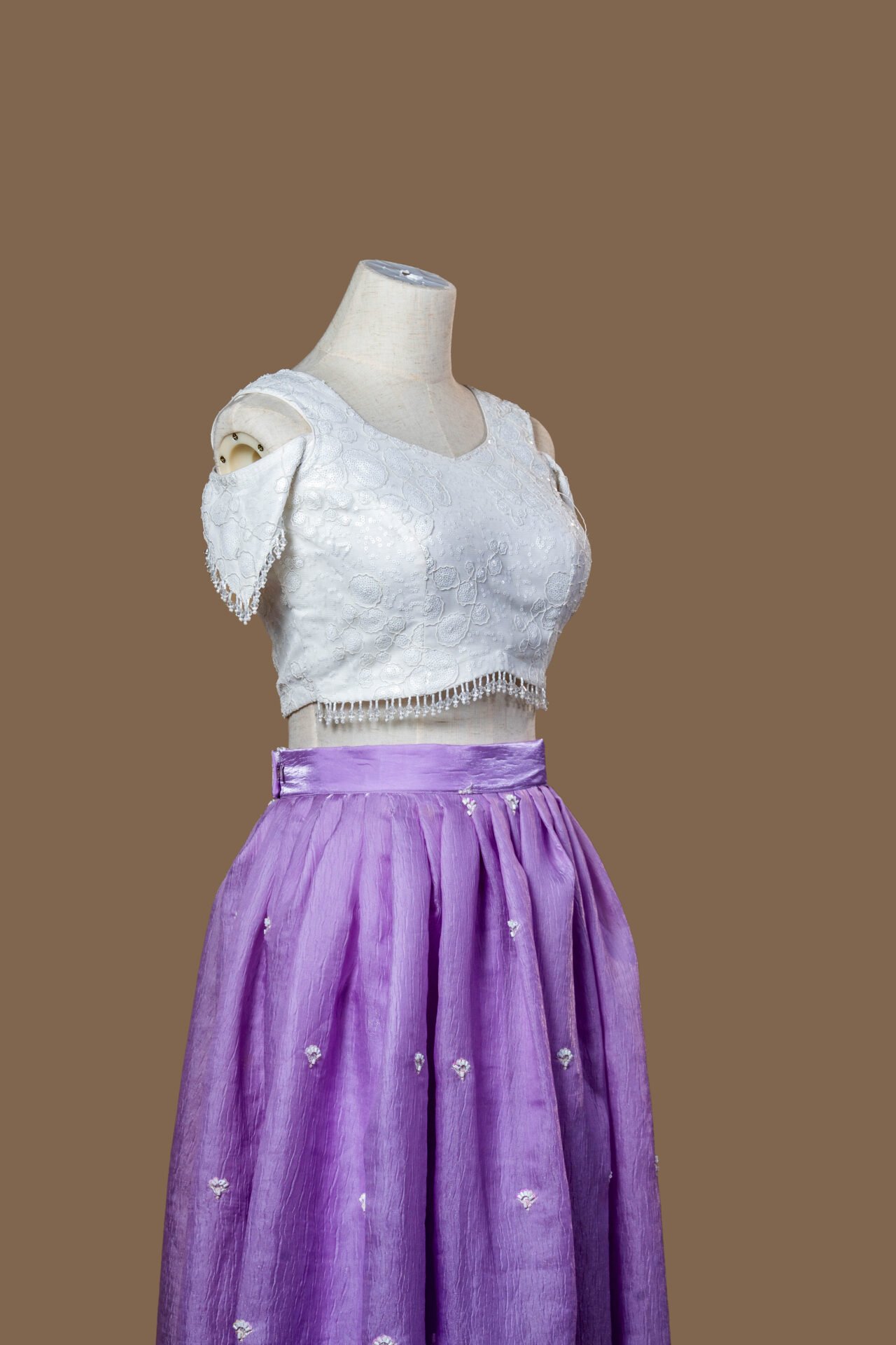Lavender Silk Skirt and White Embellished Cold-Shoulder Crop Top Set.